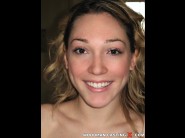 Lily labeau is sited on a sofa, legs appart and looking at you